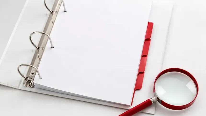 An organised overview of printed documents fanned out on a desk